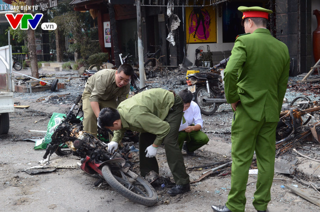 Hiện trường ngổn ngang, kinh doanh đình trệ sau vụ cháy trên đường Trần Thái Tông - Ảnh 4.