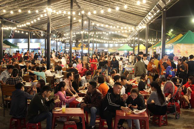 Enjoying food at the night market.