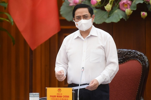 
Prime Minister Pham Minh Chinh chairs a meeting on COVID-19 prevention and control on April 26. Photo: VGP
