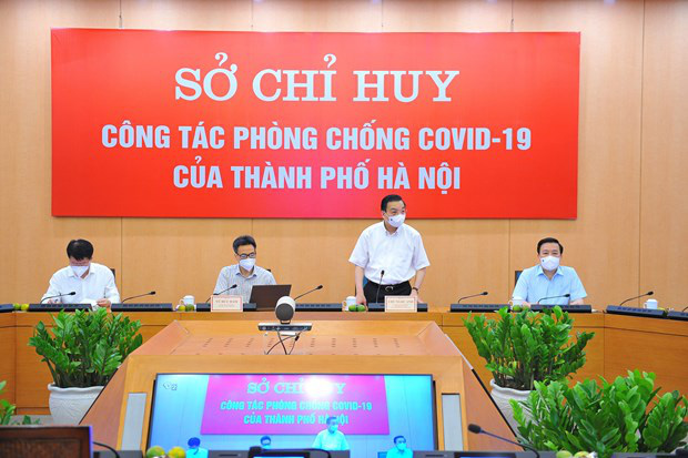 
Chairman of the Hanoi Peoples Committee addresses at the working session with Deputy Prime Minister Vu Duc Dam (Photo: VNA)
