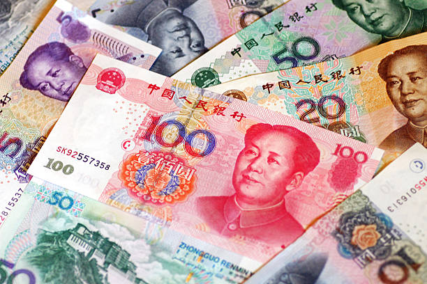 Đồng Nhân dân tệ chịu áp lực giảm giá sau khi PBOC hạ lãi suất - Ảnh 1.