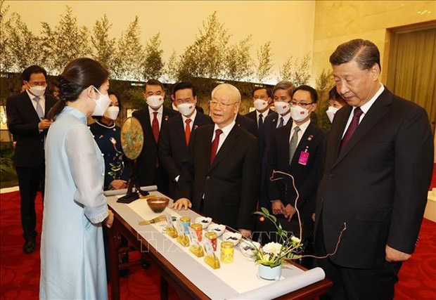 
The two leaders at the tea party. (Photo: VNA)
