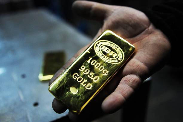 Giá vàng giảm gần 1 triệu đồng - Ảnh 1.