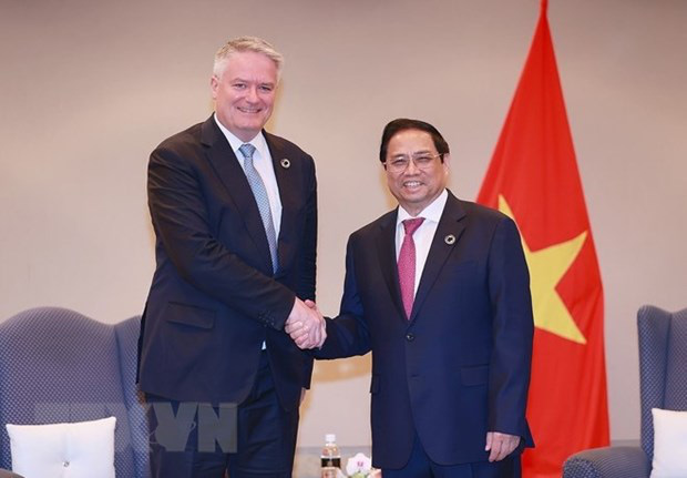 
PM Pham Minh Chinh and OECD Secretary-General Mathias Cormann (Photo: VNA)
