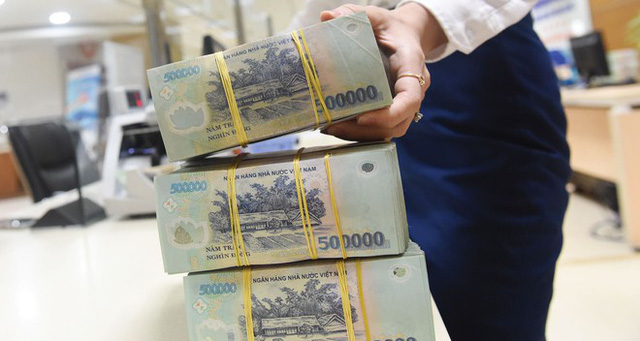 Luật tổ chức tín dụng sửa đổi tháo gỡ khó khăn xử lý nợ xấu - Ảnh 1.