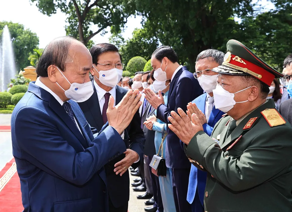 [ẢNH] Lễ đón Tổng Bí thư, Chủ tịch nước Lào Thongloun Sisoulith thăm hữu nghị chính thức Việt Nam - Ảnh 18.