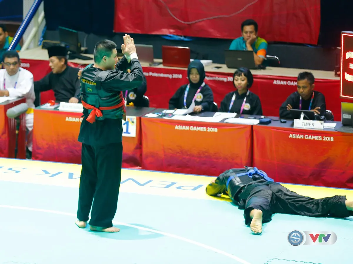 ASIAD 2018: Nguyễn Văn Trí đem về tấm HCV đầu tiên cho Pencak Silat - Ảnh 2. ASIAD 2018: Nguyễn Văn Trí đem về tấm HCV đầu tiên cho Pencak Silat - Ảnh 2.