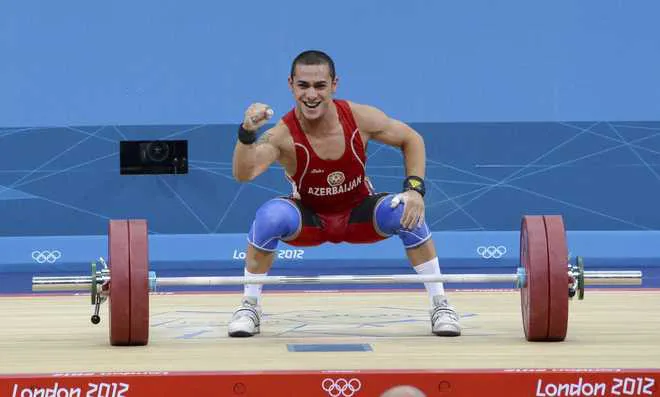 Trần Lê Quốc Toàn bất ngờ nhận HCĐ cử tạ Olympic London 2012 - Ảnh 1. Trần Lê Quốc Toàn bất ngờ nhận HCĐ cử tạ Olympic London 2012 - Ảnh 1.
