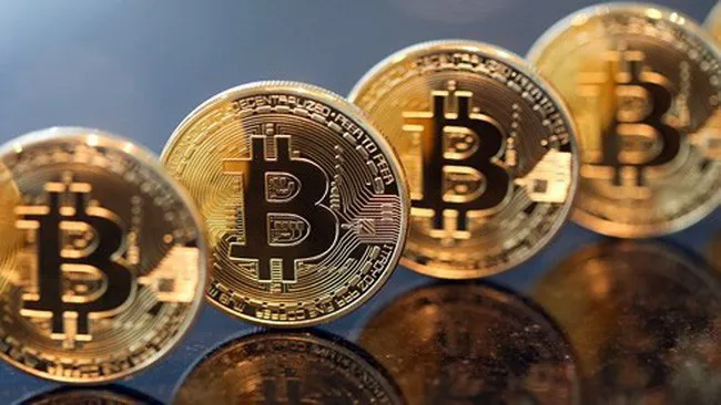 Giá đồng Bitcoin lần đầu tiên vượt ngưỡng 20.000 USD - Ảnh 1.