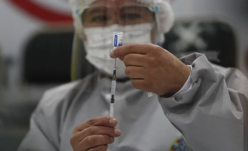 Vaccine Sputnik V đạt hiệu quả khoảng 91% trong việc ngăn ngừa COVID-19 - Ảnh 1.