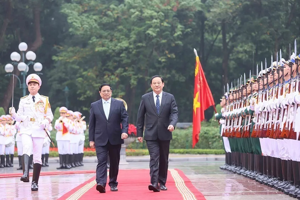 Thủ tướng Phạm Minh Chính chủ trì Lễ đón Thủ tướng Lào Sonexay Siphandone thăm chính thức Việt Nam - Ảnh 1.