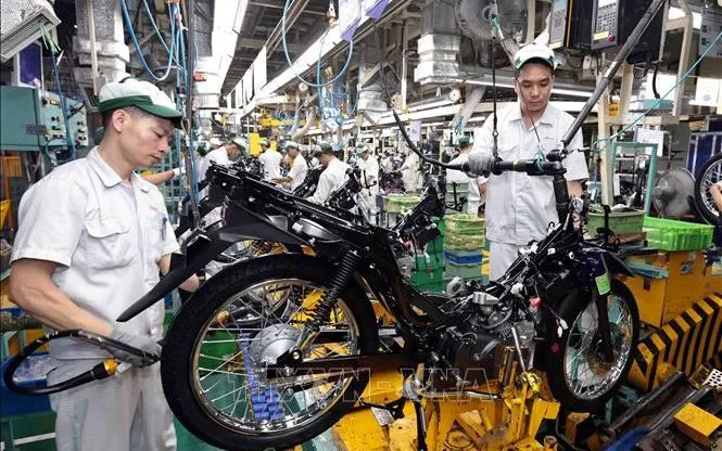 Dây chuyền sản xuất  xe gắn máy tại nhà máy Honda Phúc Yên, Vĩnh Phúc. Ảnh: Trần Việt/TTXVN