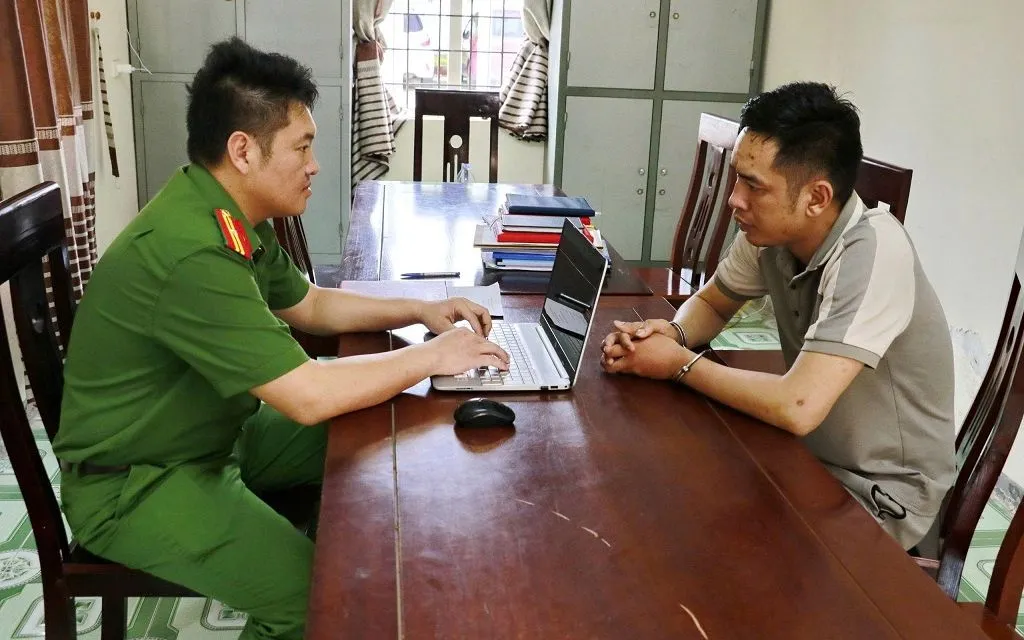 Võ Tuấn Anh tại Cơ quan Công an. Ảnh CANA.