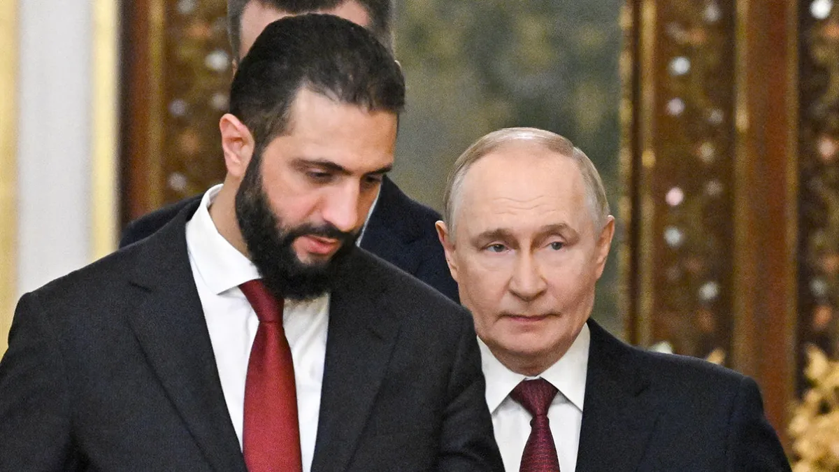 Tổng thống Nga hội đ&agrave;m với Tổng thống l&acirc;m thời Syria tại Điện Kremlin - Ảnh 1.