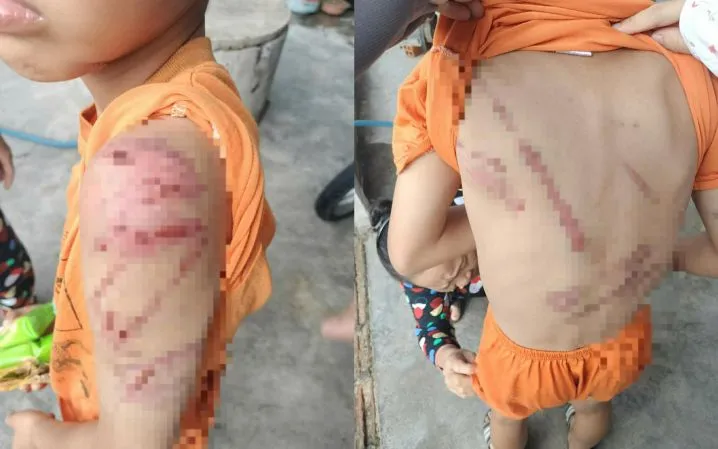 Hình ảnh bé trai bị bố bạo hành lan truyền trên mạng xã hội.