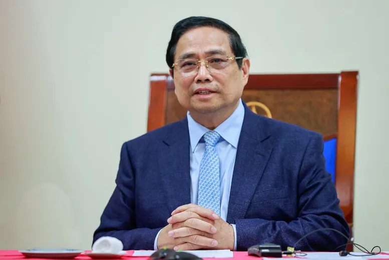 Thủ tướng Phạm Minh Ch&iacute;nh điện đ&agrave;m với Thủ tướng Qatar- Ảnh 1.