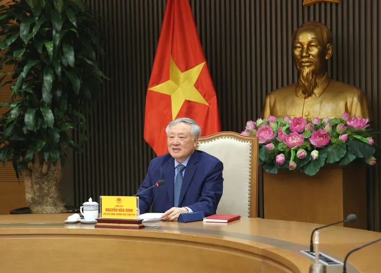 Ph&oacute; Thủ tướng Thường trực Nguyễn H&ograve;a B&igrave;nh điện đ&agrave;m với nguy&ecirc;n Ph&oacute; Thủ tướng Singapore Vương Thụy Kiệt - Ảnh 1.