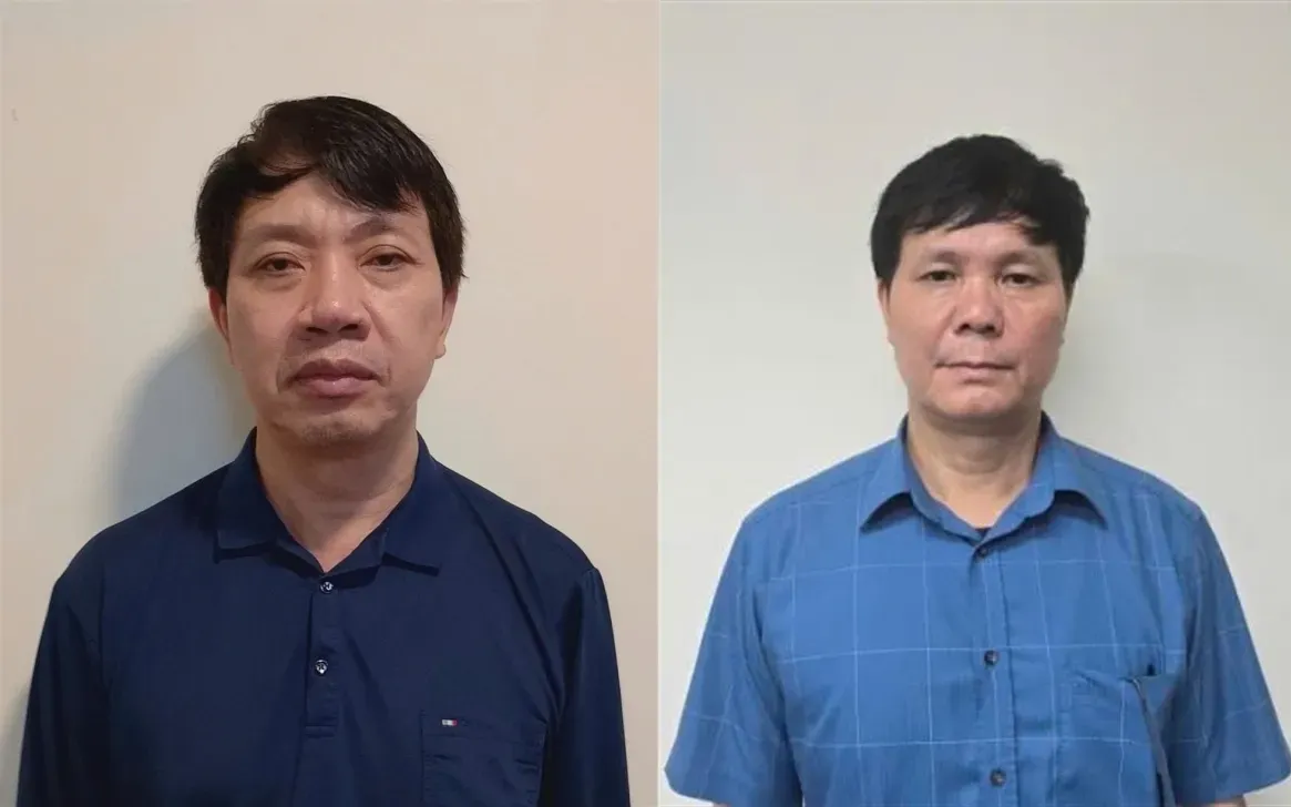 Bị can Lê Đức Giang (trái) và bị can Phạm Văn Hoành tại cơ quan công an. (Ảnh: Công an cung cấp)