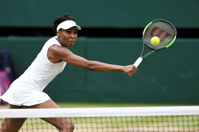 Vượt qua Venus Williams, Garbine Muguruza lần đầu vô địch Wimbledon - Ảnh 1.