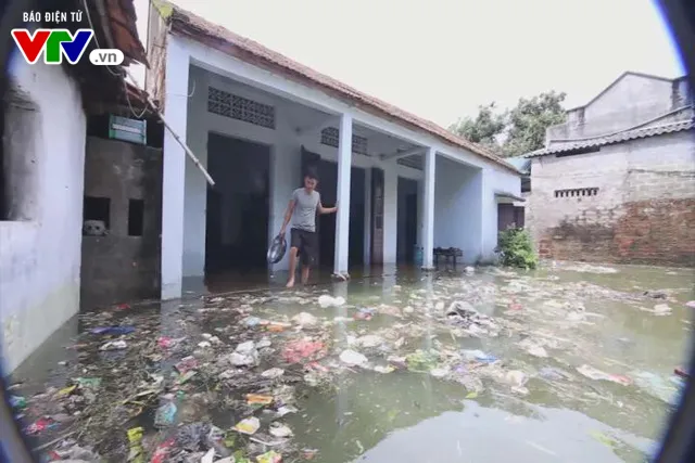 Khám sức khỏe cho 8.500 người dân vùng ngập úng ở Hà Nội - Ảnh 1.