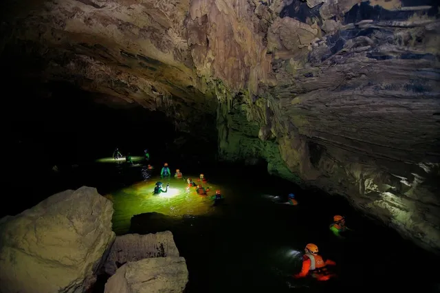 
The Google Adventure Vietnam production team members wade inside Tu Lan Cave in Quang Binh Province, north-central Vietnam. Photo: Google Adventure Vietnam
