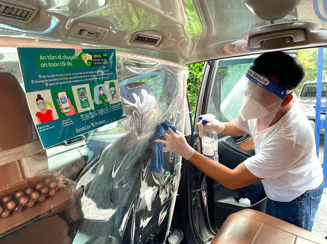 Grab mở lại dịch vụ GrabCar tại Hà Nội - Ảnh 1.