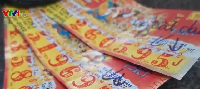 Làm vé số trúng thưởng giả để... đổi tiền thật - Ảnh 1. Làm vé số trúng thưởng giả để... đổi tiền thật - Ảnh 1.