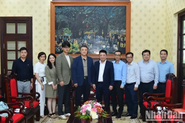 Nhan Dan Newspaper and Xinhua News Agency strengthen cooperation - Ảnh 3.