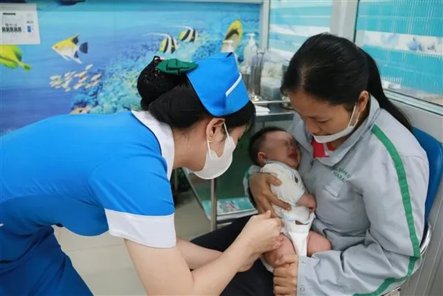 WHO, UNICEF commend Vietnam’s progress in childhood immunisation - Ảnh 1.