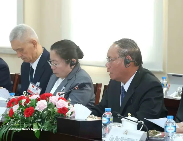 Permanent member of Party Central Committee’s Secretariat holds talks with Lao counterpart - Ảnh 2.