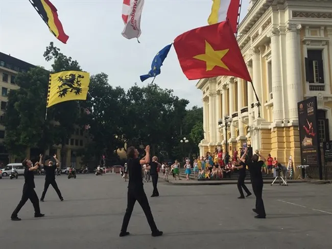 The flag-throwing routine was completely on sync. (Photo: VNA)