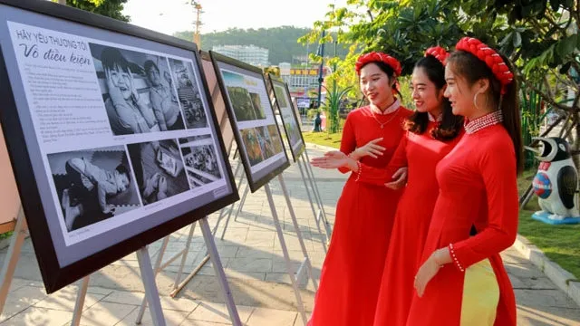 Visitors admiring photos at the exhibition