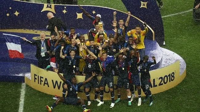 The new World Cup champions, France, celebrate with the trophy. (Photo: FIFA)