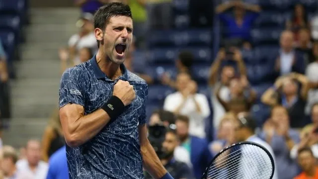 Djokovic reacts during the quarterfinal match against Millman. (Reuters)