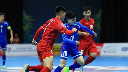 Vietnam (in red) make it through to the quarterfinals following two wins and one loss in the group stage.