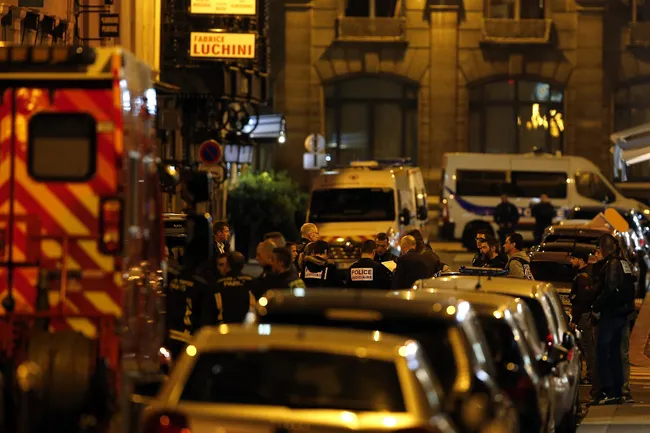 Police officers cordon off the area after a knife attack in central Paris, May 12, 2018. (AP/Thibault Camus)