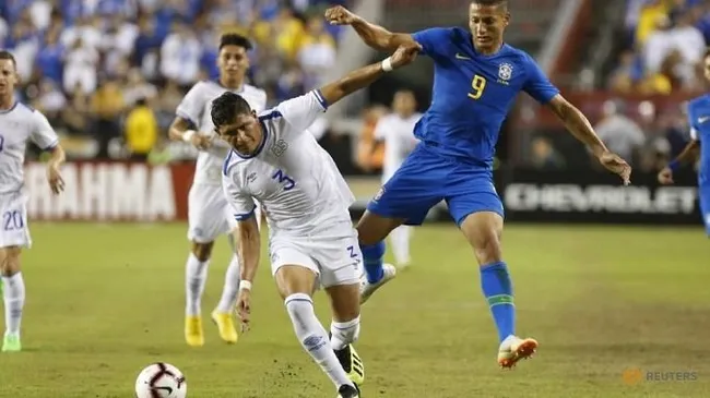 El Salvador defender Roberto Dom’nguez (3) and Brazil forward Richarlison (9) battle for the ball in the first half during an international friendly soccer match at FedEx Field. (Reuters)