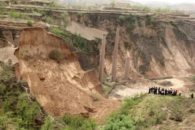 People gathering near the site of a landslide that has claimed at least nine lives, in Caijiazhuang village, Shanxi province, on April 30, 2018.PHOTO: EPA-EFE