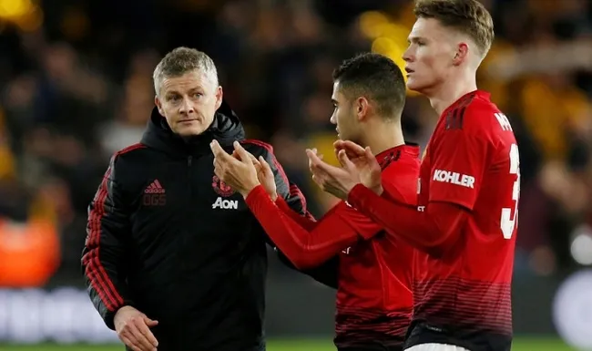 FA Cup Quarter Final - Wolverhampton Wanderers v Manchester United - Molineux Stadium, Wolverhampton, Britain - March 16, 2019 Manchester United interim manager Ole Gunnar Solskjaer looks dejected after the match with Scott McTominay and Andreas Pereira. (Reuters)