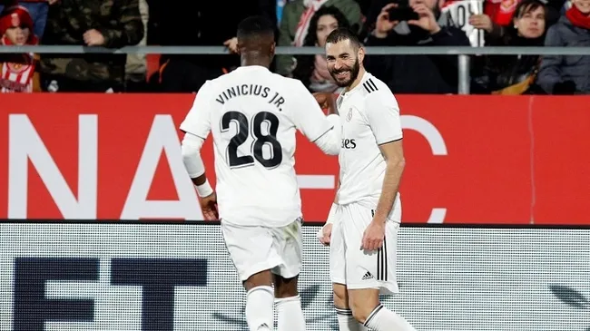 Real Madrid's Karim Benzema celebrates scoring their second goal with Vinicius Junior. (Reuters)