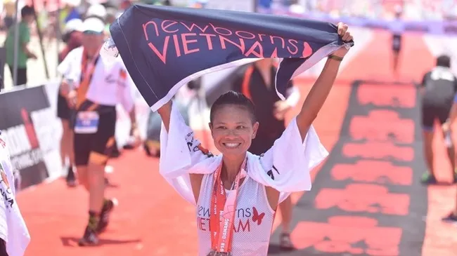 A triathlete finishes the Ironman 70.3 Vietnam race in Da Nang. (Photo: Ironman Vietnam)
