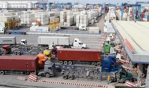 Trucks transfer containers to HCM City’s Cat Lai Port, the common hub of plastic waste imported into Vietnam