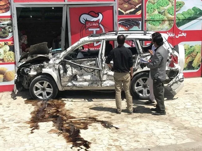 Afghans look at at a car hit damaged a suicide bomb blast in Kabul, Afghanistan May 31, 2019. (Photo: Reuters)