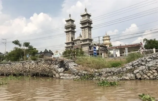 The erosion happened along the Ong Chuong river  (Photo: VNA)