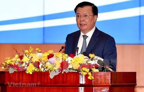 Minister of Finance Dinh Tien Dung speaks at the January 10 conference held in Hanoi to review the State budget and finance last year. (Photo: VNA)
