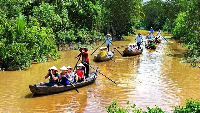 Visitors taking a boat trip to explore An Binh Islet