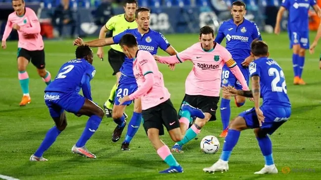 Soccer Football - La Liga Santander - Getafe v FC Barcelona - Coliseum Alfonso Perez, Getafe, Spain - October 17, 2020 FC Barcelona's Lionel Messi in action with Getafe's Nemanja Maksimovic. (Reuters)