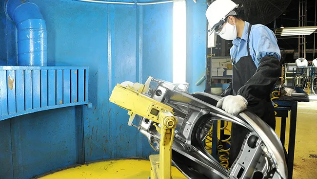 Motorcycle frame manufacturing at Piaggio Vietnam Co., Ltd. at Binh Xuyen industrial zone in Vinh Phuc province. (Photo: Ha Thanh)