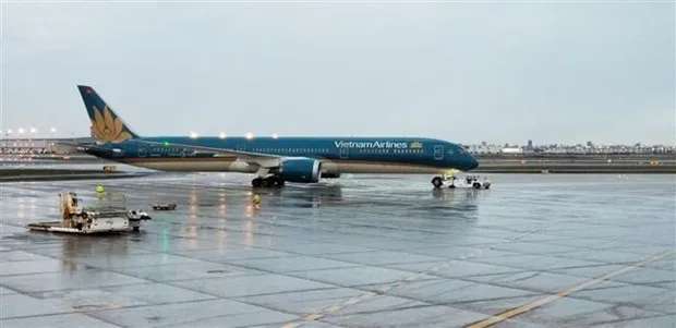 More than 340 Vietnamese citizens were flown home from Australia and New Zealand on December 9 on a Vietnam Airline flight. (Photo: VNA)