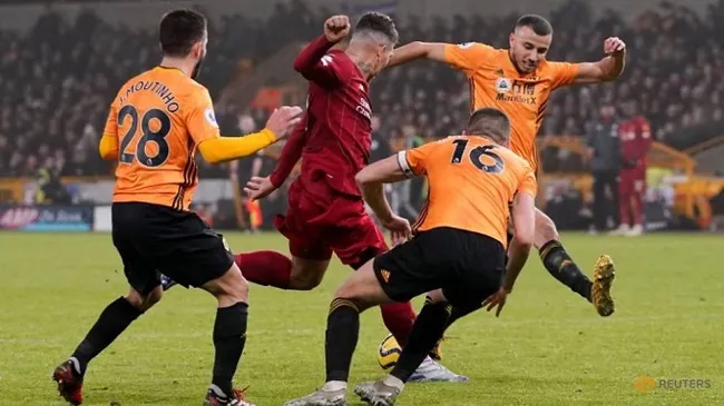 Soccer Football - Premier League - Wolverhampton Wanderers v Liverpool - Molineux Stadium, Wolverhampton, Britain - January 23, 2020 Liverpool's Roberto Firmino scores their second goal. (Reuters)